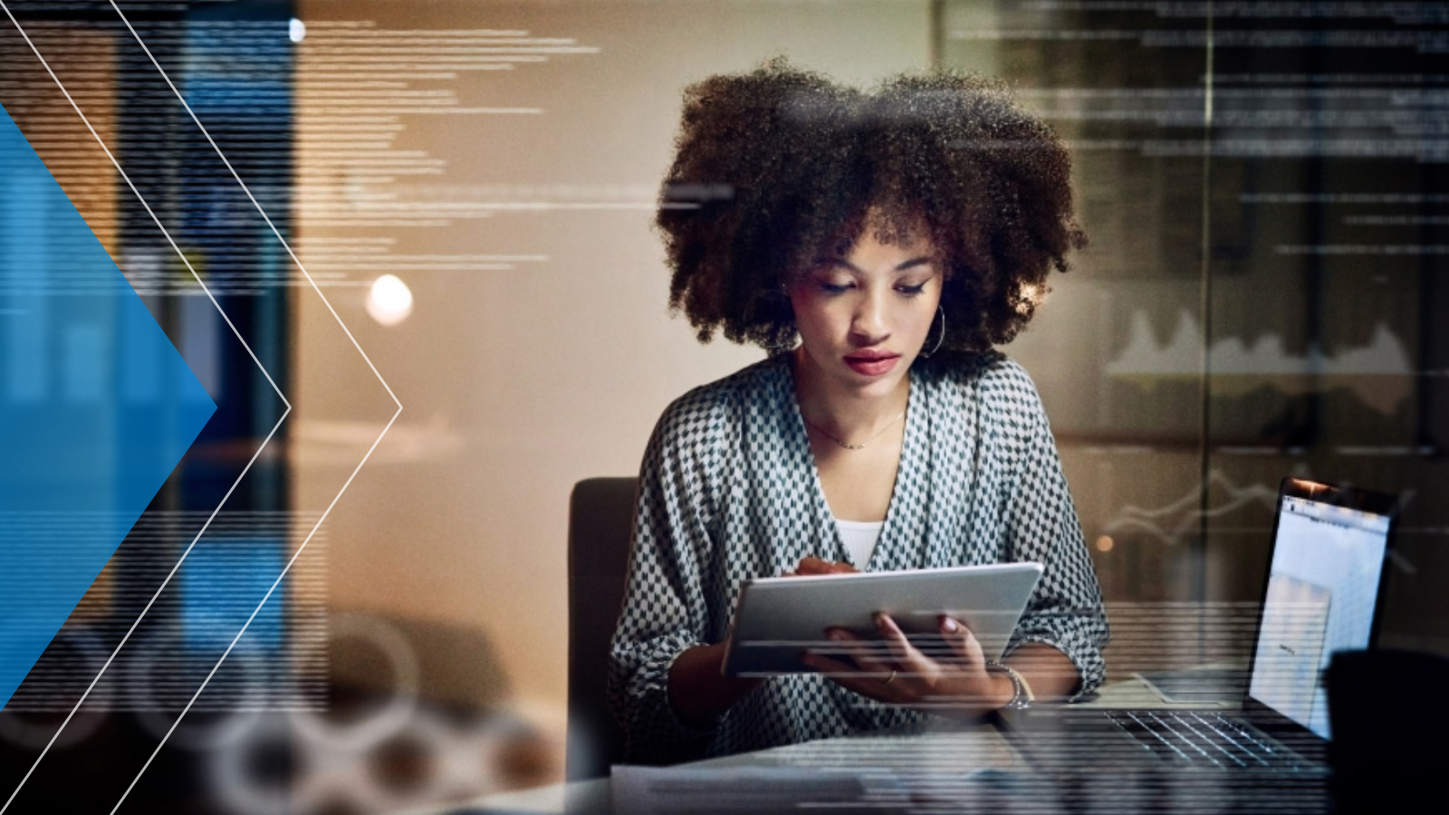 Treasury management executive working on a tablet in her office.