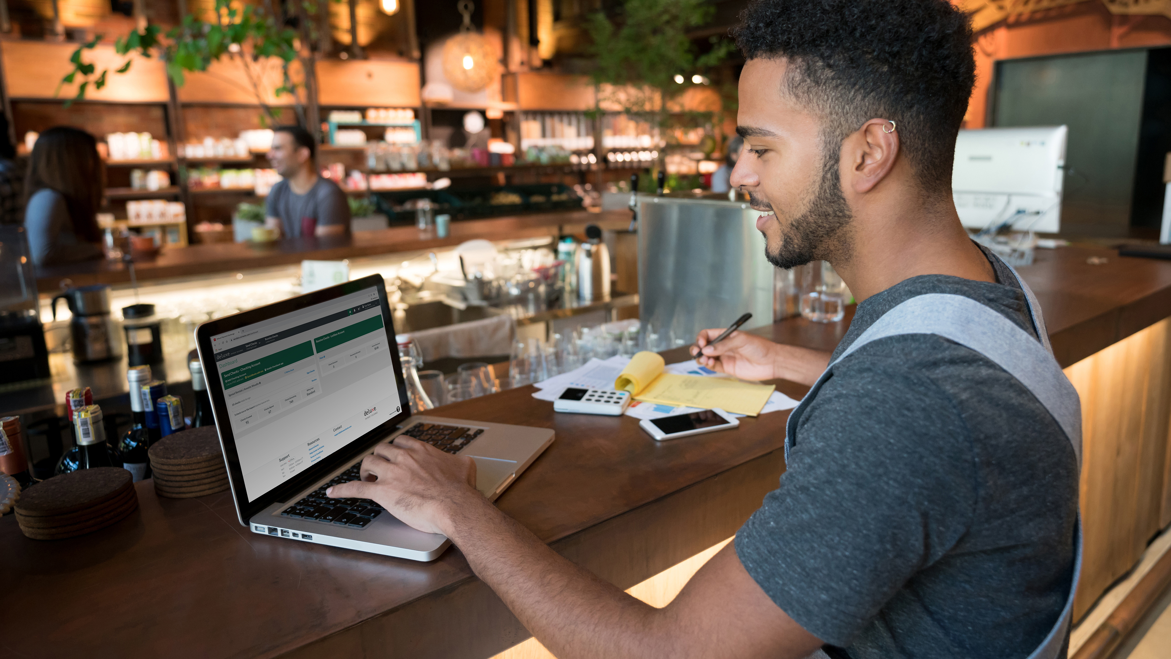 Restaurant worker on laptop